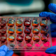 A scientist in Panama handling lab samples while conducting covid-19 research